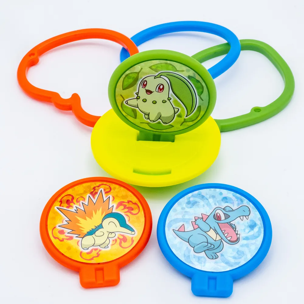 The Wobbling Ring Toss in play, with three colored rings being thrown at a Chikorita panel mounted on the base