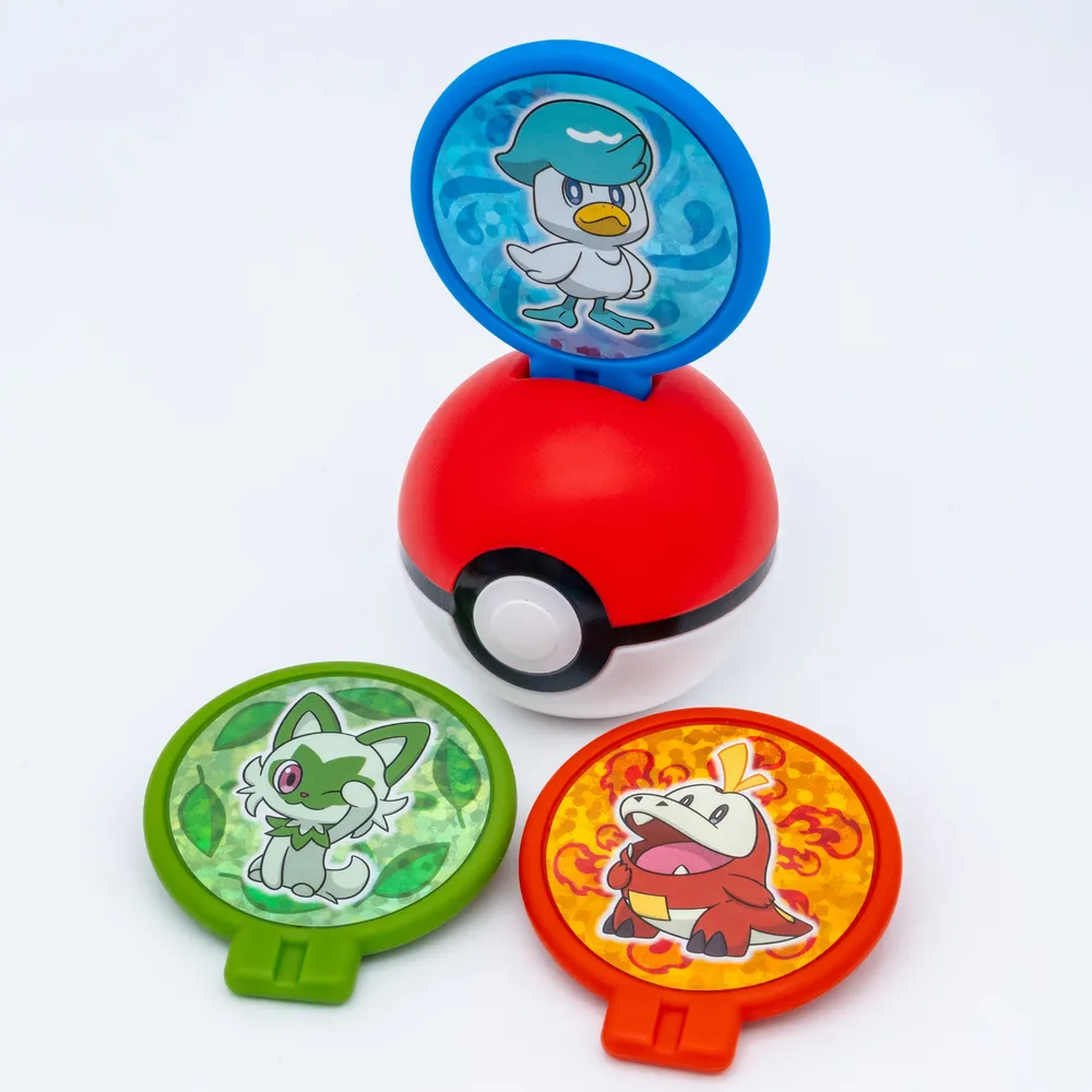 The Poké Ball Sticker Case with a Quaxly panel standing upright on its lid