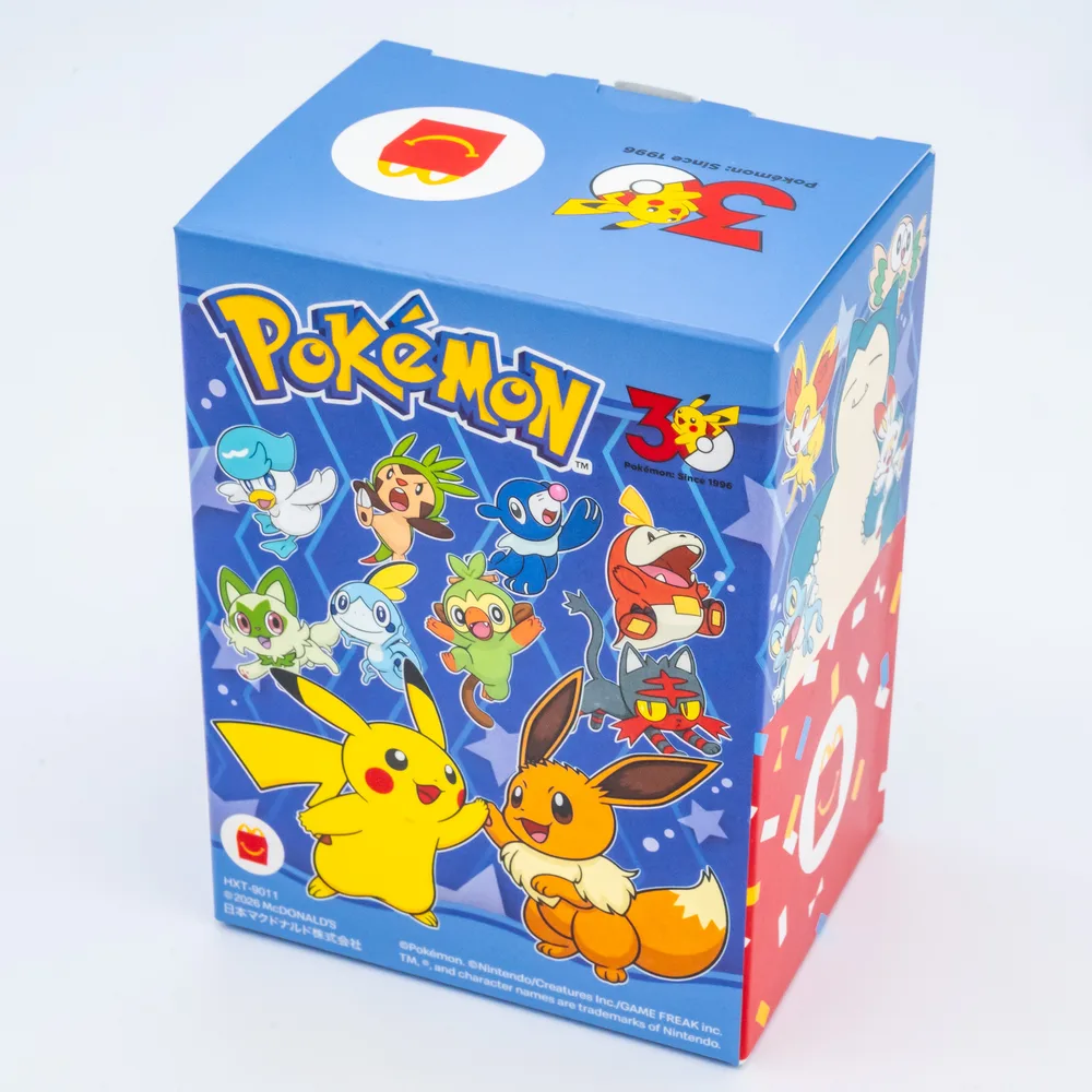 Blue night themed McDonald's Happy Meal box with stars and a sleeping Snorlax printed on the side