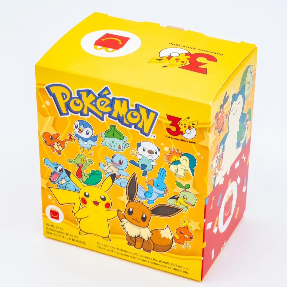 Yellow McDonald's Happy Meal box printed with Pikachu, Eevee and the first partner Pokémon from every generation